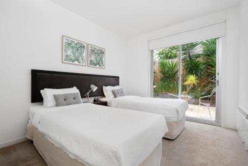 Ліжко або ліжка в номері Brighton Bay Apartments