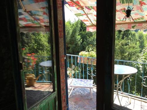 a window view of a patio with a spider on it at Casa toscana in Thun