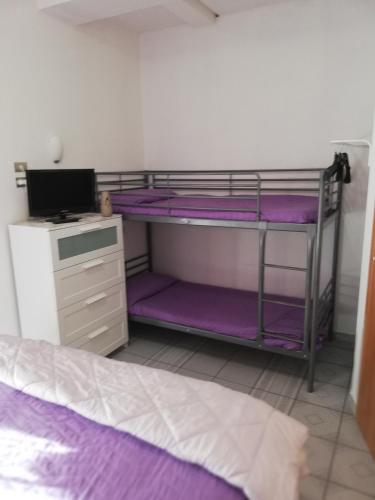 Ένα ή περισσότερα κρεβάτια σε δωμάτιο στο B&B Vittorio Emanuele