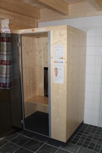a locker in a bathroom with a sign on it at Schlosswirt Chalets & Apartments in Großkirchheim