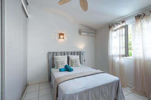 Ένα ή περισσότερα κρεβάτια σε δωμάτιο στο La Conque du Trou d'eau