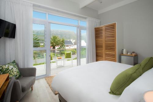Un pat sau paturi într-o cameră la Bamboo Guest House
