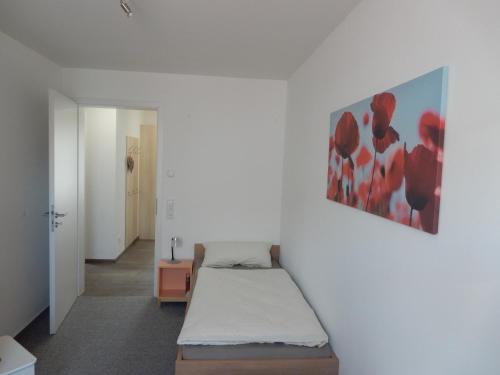 Tempat tidur dalam kamar di Beim Kellerschneider EG