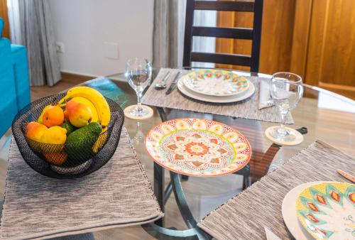 a table with a bowl of fruit on it at Carrasco 4 in Vélez-Málaga