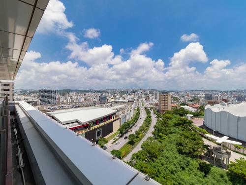 a view of the city from the roof of a building at Daiwa Roynet Hotel Naha Omoromachi in Naha