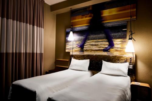 Postel nebo postele na pokoji v ubytování Ibis Milano Centro