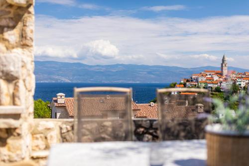 a view of a city from a balcony with a view at Villa Pinia in Vrbnik