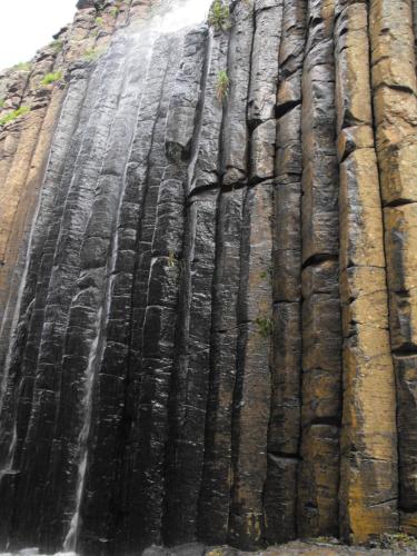 a waterfall on the side of a rock formation at Hotel Bella Vista in Huasca de Ocampo