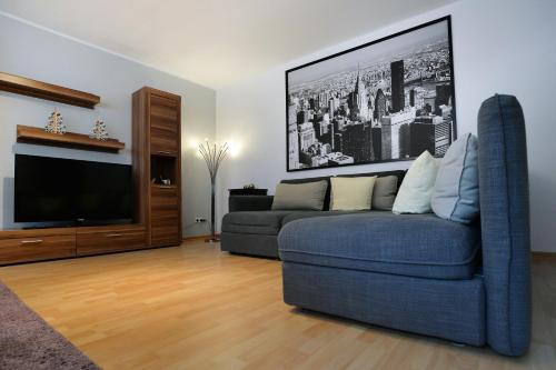 a living room with a couch and a flat screen tv at Haus Daniela Superior in Cochem