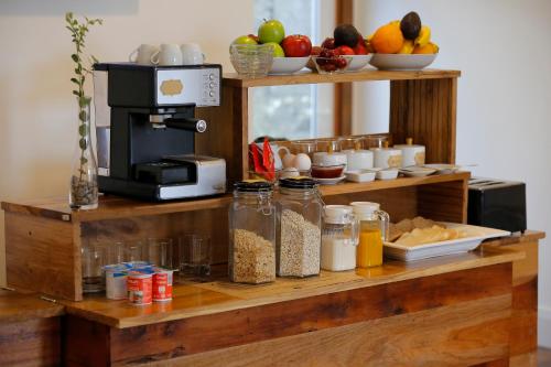 a counter with various food items on it at Hotel Nueve Ríos in Valdivia