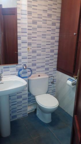 a bathroom with a white toilet and a sink at BAHIA MAZARRON apartamento en primera linea playa in Puerto de Mazarrón