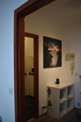a room with a mirror and a picture on the wall at FeWo Köln in Cologne