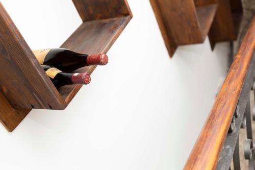 a bottle of wine in a wooden box at Albergo Sacro Monte Varese in Varese