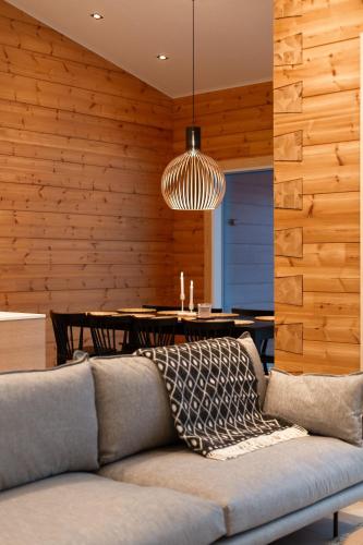 a living room with a couch and a table at Riverside luxury suites in Rovaniemi