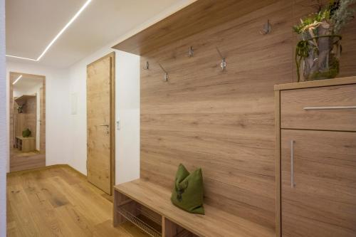 a room with a wall of wood at Ferienwohnungen Obinghof in Söll