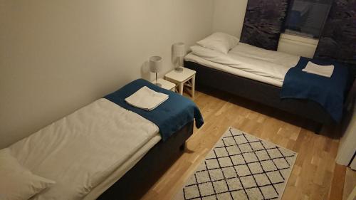 Postel nebo postele na pokoji v ubytování Reindeer City Apartment