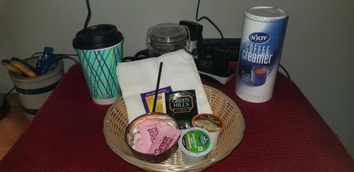 a basket of food and drinks on a table at Hallowell Rooming House in Hallowell