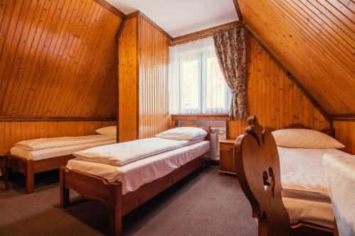 Posteľ alebo postele v izbe v ubytovaní DW Kościelec