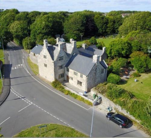 an aerial view of a large house with a street at Great House Guest House in Llantwit Major