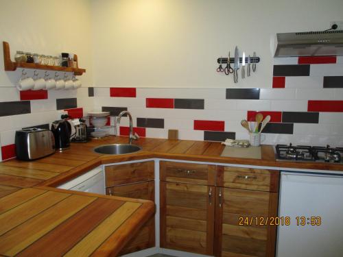a kitchen with a sink and a counter top at Tauhara Luxury Apartment in Okaihau