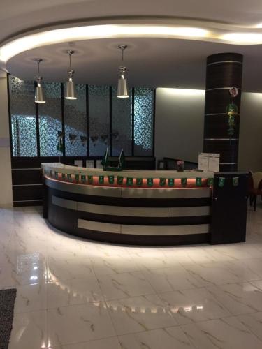 a lobby with a reception desk in a building at Top View Apartments in Al Hofuf