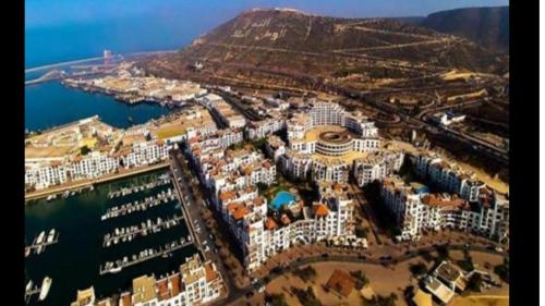 an aerial view of a city next to the water at Luxury Flat Marina Agadir in Agadir