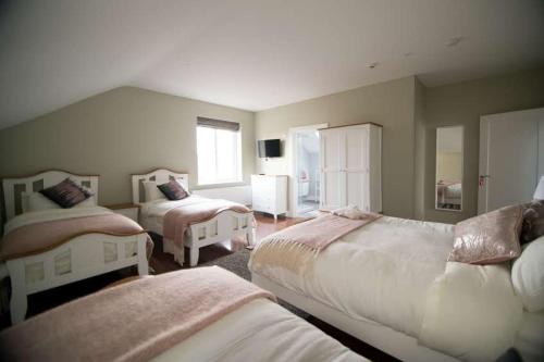 Letto o letti in una camera di West Haven House