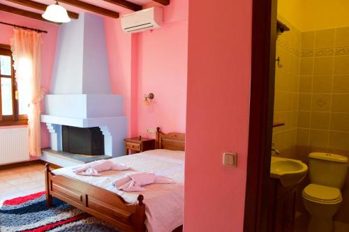 Postel nebo postele na pokoji v ubytování Aegean House