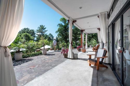 a porch of a house with a patio at Casa Prana Hotel in Atitlan in Santa Cruz La Laguna