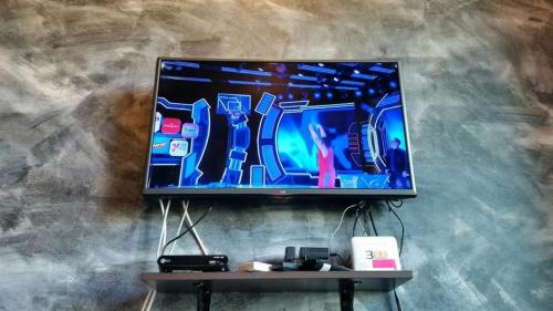 a flat screen tv hanging on a wall at Ban View Viman Condo in Hua Hin