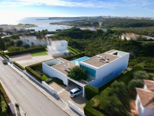an aerial view of a house with a road at Casa dos Pátios in Sagres