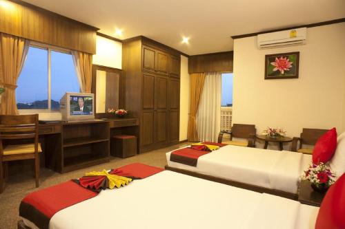 Кровать или кровати в номере Royal Panerai Hotel Chiangmai