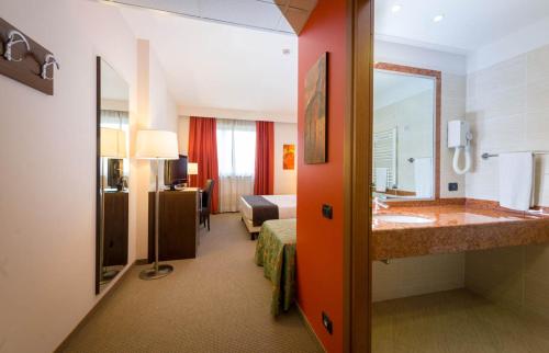 Postel nebo postele na pokoji v ubytování Torino Hotel San Luigi - Ristorante Trait d'Union