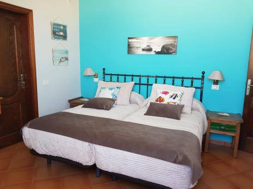Cama ou camas em um quarto em Ajuy