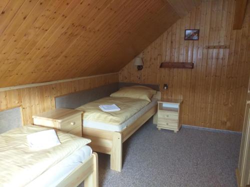Posteľ alebo postele v izbe v ubytovaní Pension Arnika