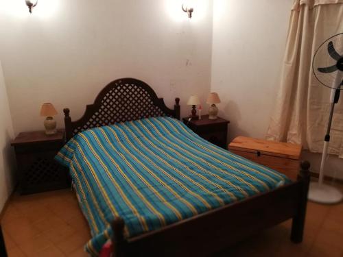 Una cama o camas en una habitación de Casa Lago Azul