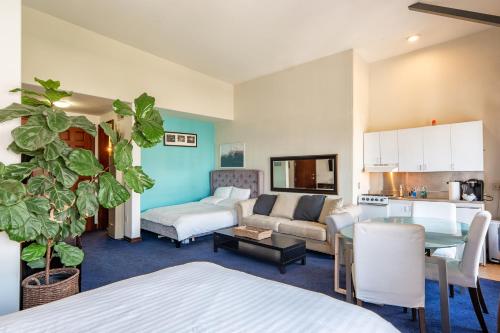 a living room with a couch and a table at Ocean Luxury Lofts and Suites in Los Angeles