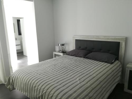 Кровать или кровати в номере Marta & Lorenzo Apartment. Fuerteventura