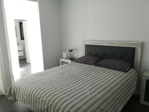 A bed or beds in a room at Marta & Lorenzo Apartment. Fuerteventura