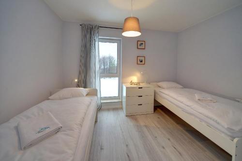 Posteľ alebo postele v izbe v ubytovaní Apart-Invest Apartament Oslo