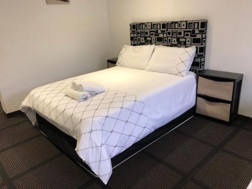 Кровать или кровати в номере Gold Reef Lodge