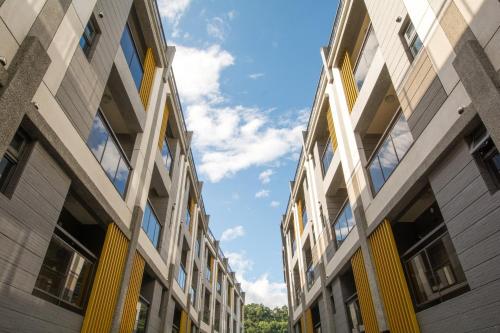 an apartment building with the sky in the background at Yilan Siao Jhu in Jiaoxi
