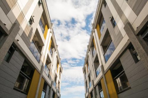 two tall buildings with the sky in the background at Yilan Siao Jhu in Jiaoxi