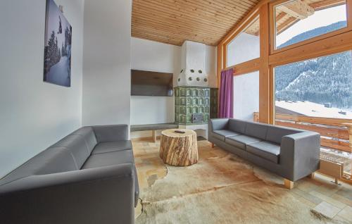 a living room with a couch and a table at D-Town Lodge in Saalbach-Hinterglemm