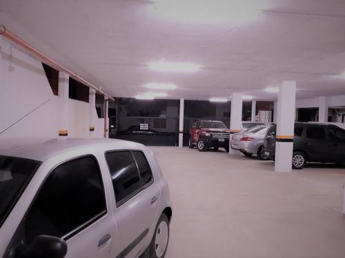 a parking lot with several cars parked in it at Victor Hotel in Villa Carlos Paz