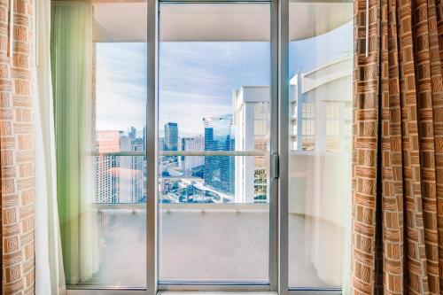 a large window with a view of a city at Jet Luxury at The Signature Condo Hotel in Las Vegas