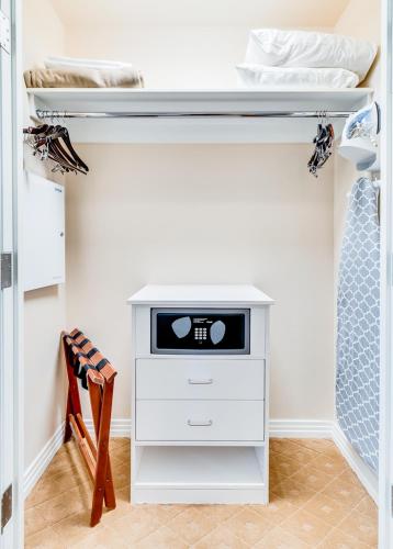 a bedroom with a bunk bed with a desk at Jet Luxury at The Signature Condo Hotel in Las Vegas
