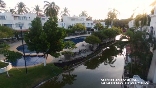 an aerial view of a swimming pool at a resort at Villa Privada ubicada en el campo de Golf del Hotel Vidanta Mayan Palace in Acapulco