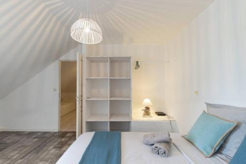 Llit o llits en una habitació de Le Bénitier