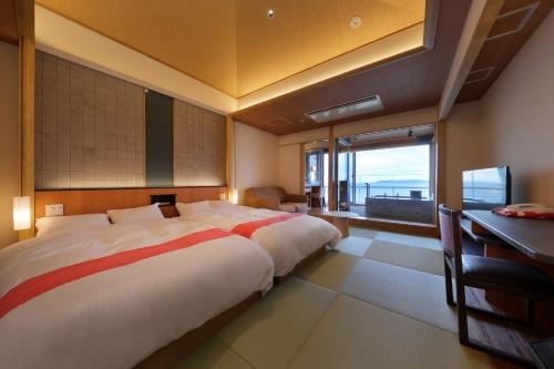 เตียงในห้องที่ Hanashibuki